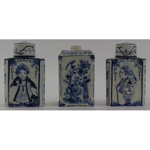 84 - Three Dutch Delft tea caddies, 18th/19th century. Comprising a pair of tea caddies with covers decor... 