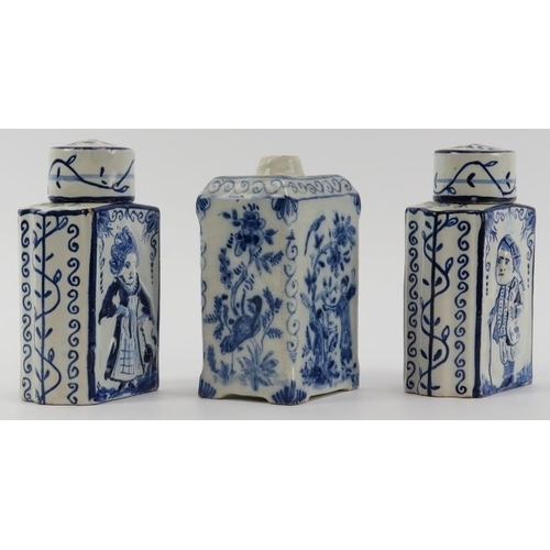 84 - Three Dutch Delft tea caddies, 18th/19th century. Comprising a pair of tea caddies with covers decor... 