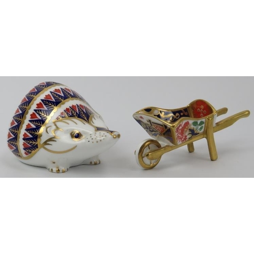 86 - A Royal Crown Derby hedgehog paperweight and a model of a wheelbarrow. (2 items) 11.5 cm length, 10.... 