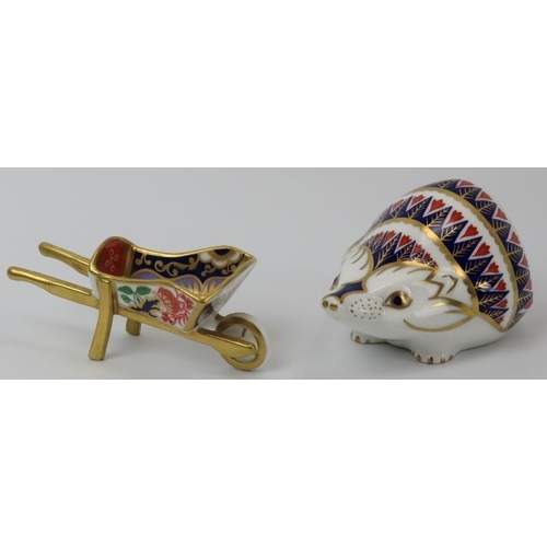 86 - A Royal Crown Derby hedgehog paperweight and a model of a wheelbarrow. (2 items) 11.5 cm length, 10.... 