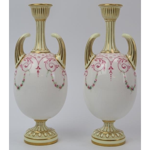 87 - A pair of Royal Worcester twin handled gilt porcelain vases, circa 1900. Both of ovoid form, hand pa... 