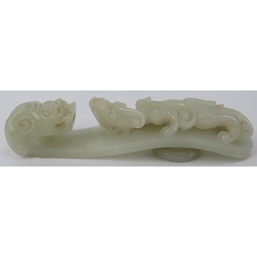 89 - A Chinese celadon jade dragon belt hook, 18th/19th century. Finely carved depicting a chilong dragon... 