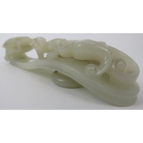 89 - A Chinese celadon jade dragon belt hook, 18th/19th century. Finely carved depicting a chilong dragon... 