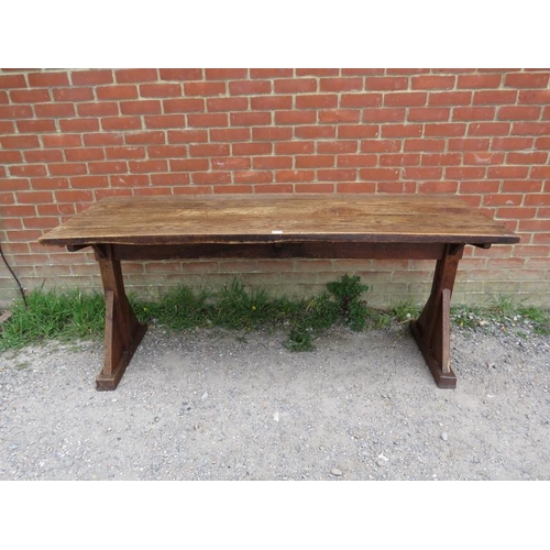 702 - A 19th century Arts & Crafts oak refectory table, the roughly hewn planked top on braced end support... 