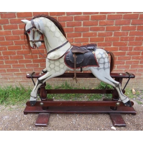 706 - A vintage dapple-grey rocking horse, with real horsehair mane and tail and leather saddle and tack, ... 