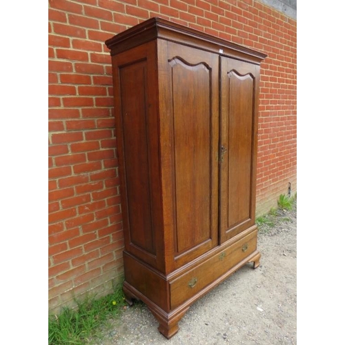 716 - An 18th century Continental oak linen press/wardrobe, having fielded front and side panels, the doub... 