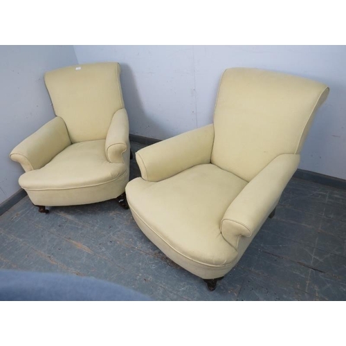 720 - A pair of 19th century club armchairs in the manner of Howard & sons, reupholstered in pale yellow m... 