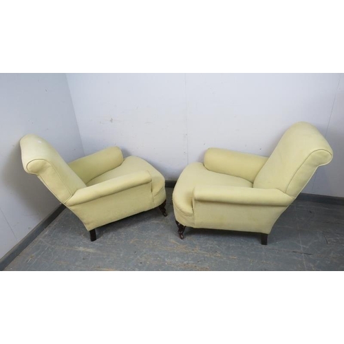 720 - A pair of 19th century club armchairs in the manner of Howard & sons, reupholstered in pale yellow m... 