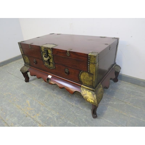 726 - A Chinese hardwood chest, having engraved brass mounts, the hinged top compartment above one long dr... 