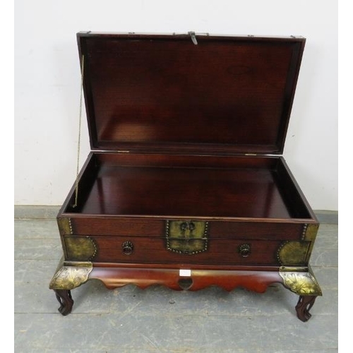 726 - A Chinese hardwood chest, having engraved brass mounts, the hinged top compartment above one long dr... 