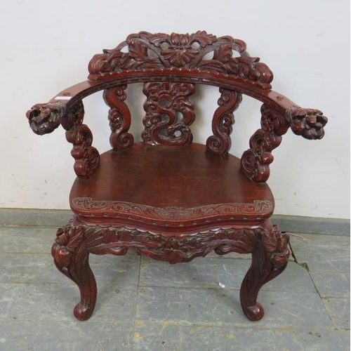 728 - An antique Chinese lacquered tub chair, having intricately carved & pierced backrest in high relief,... 