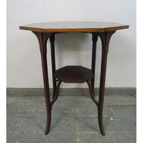 729 - An Edwardian mahogany octagonal table, crossbanded and strung with ebony and boxwood, on inlaid tape... 