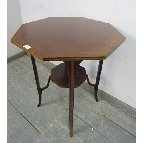 729 - An Edwardian mahogany octagonal table, crossbanded and strung with ebony and boxwood, on inlaid tape... 