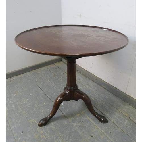 733 - A George III mahogany ‘birdcage’ tilt-top table, the dished top above a plain tapering column with s... 