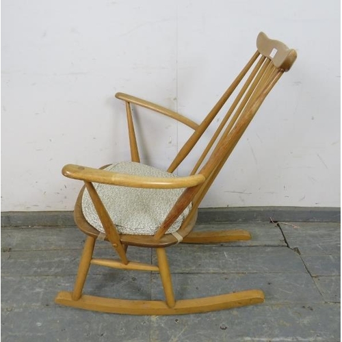 734 - A mid-century blond elm & beech ‘Goldsmiths’ rocking chair by Ercol (model 435) on canted supports w... 