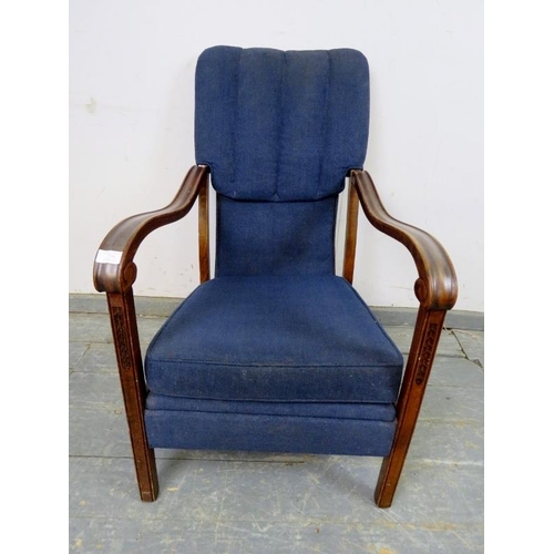 739 - An Art Deco Period walnut open-sided armchair, upholstered in navy material, the shaped and scrolled... 