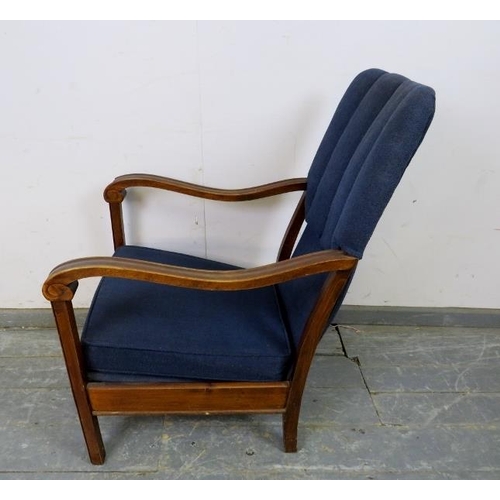 739 - An Art Deco Period walnut open-sided armchair, upholstered in navy material, the shaped and scrolled... 