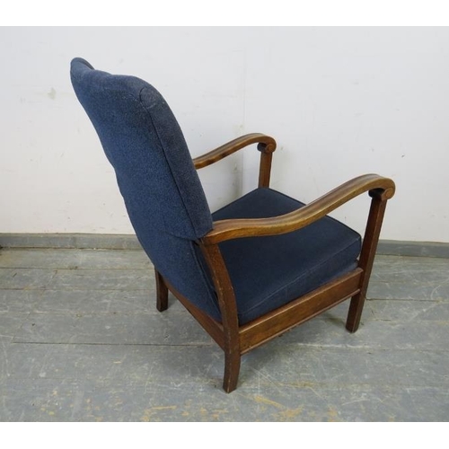 739 - An Art Deco Period walnut open-sided armchair, upholstered in navy material, the shaped and scrolled... 