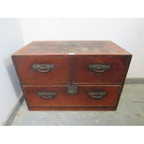 745 - An antique Meiji Period Japanese tansu chest, having two short above one long drawer with pierced ca... 