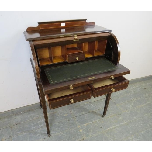 746 - An Edwardian mahogany cylinder writing desk strung with boxwood, the lid opening onto a fitted inter... 