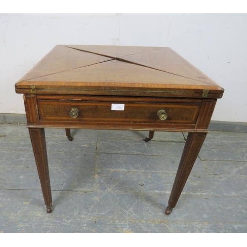 748 - An Edwardian mahogany inlaid and crossbanded envelope card table, having one long frieze drawer, on ... 