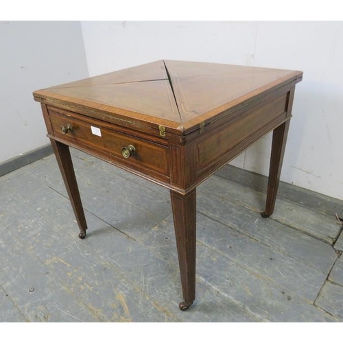 748 - An Edwardian mahogany inlaid and crossbanded envelope card table, having one long frieze drawer, on ... 