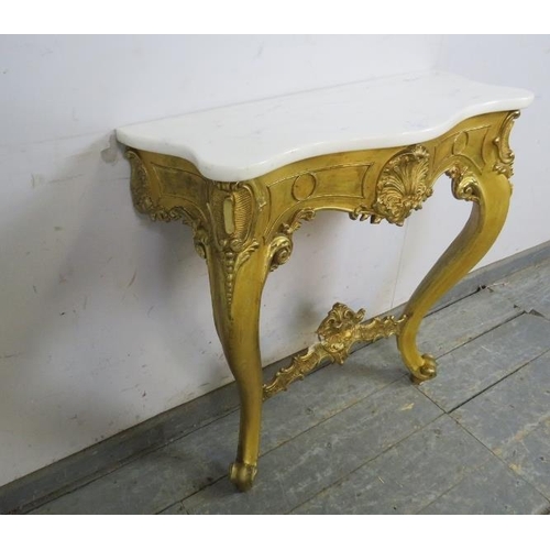 752 - A vintage French giltwood console table, the white marble serpentine top on an ornate giltwood base ... 