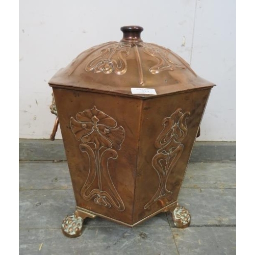 753 - An Arts & Crafts Period hexagonal copper coal bucket, having repousse decoration and lion mask drop-... 