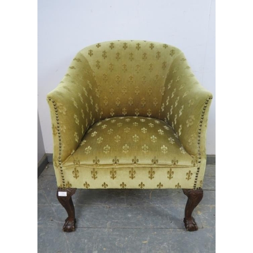 758 - An antique mahogany tub chair in the Georgian taste, upholstered in patterned material with brass st... 