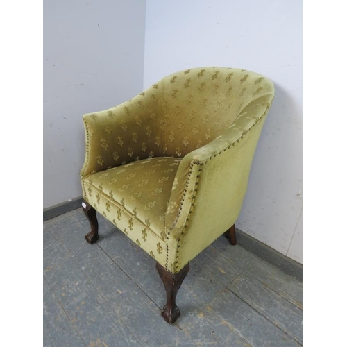 758 - An antique mahogany tub chair in the Georgian taste, upholstered in patterned material with brass st... 