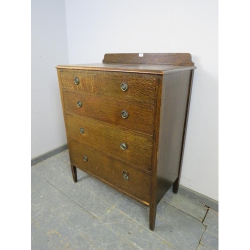 767 - An Edwardian quartersawn oak chest, housing two short above three long graduated oak-lined drawers w... 