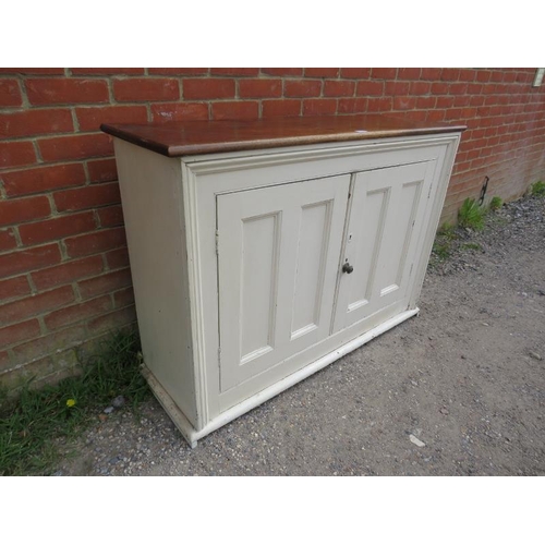 772 - An antique kitchen sideboard, the fruitwood top above a cream painted base, having twin panelled doo... 