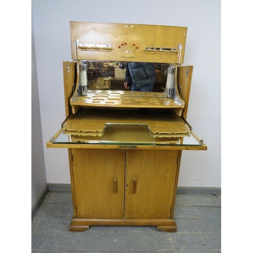 774 - A vintage Art Deco Revival light oak drinks cabinet, the top section with fall front and rising lid ... 