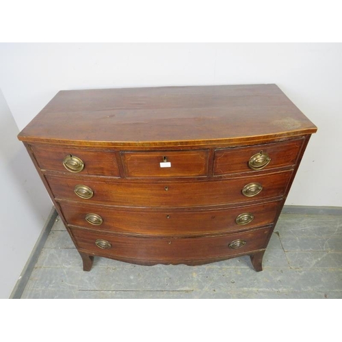 777 - A George III mahogany bow-fronted chest strung with boxwood, housing three short above three long gr... 