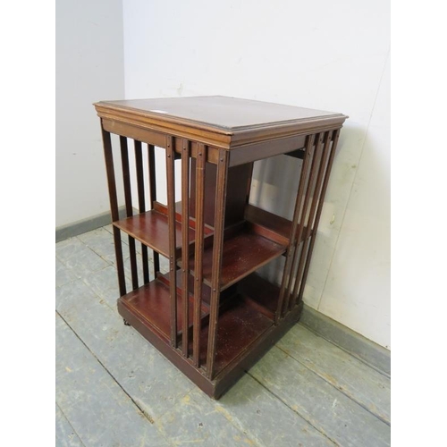 779 - An Edwardian mahogany book table, crossbanded and strung with ebony and boxwood, with batwing marque... 