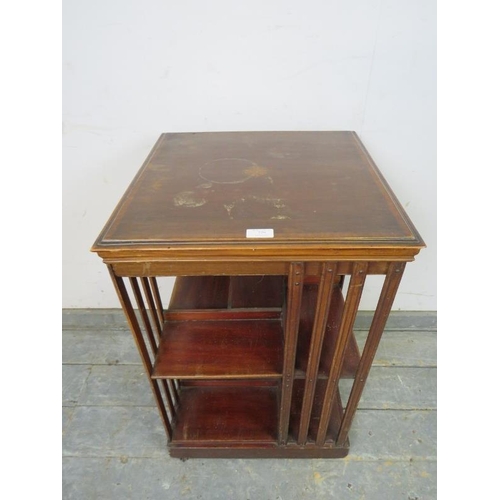 779 - An Edwardian mahogany book table, crossbanded and strung with ebony and boxwood, with batwing marque... 