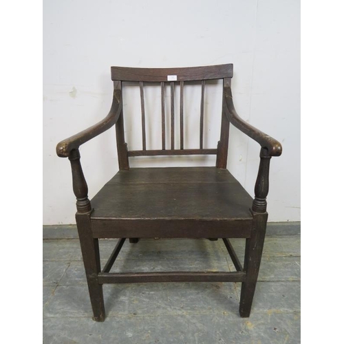 795 - A Georgian elm & oak country elbow chair, the scrolled arms joined by turned uprights to the planked... 