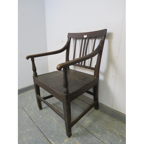 795 - A Georgian elm & oak country elbow chair, the scrolled arms joined by turned uprights to the planked... 