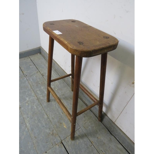 799 - A vintage stained pine artist’s stool, on canted supports with stretchers. 
H60cm W33cm D20cm (appro... 