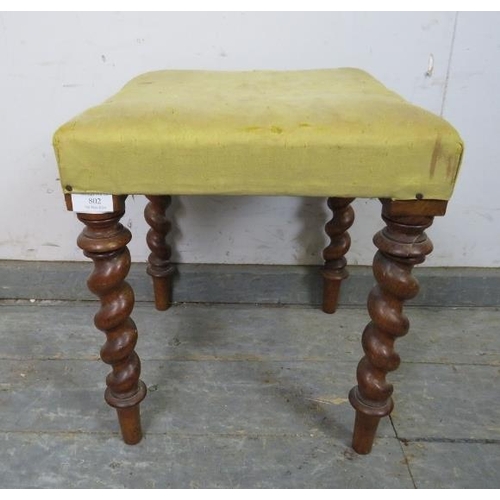 802 - A small 19th century walnut stool, upholstered in pale yellow damask, on tapering barley twist suppo... 