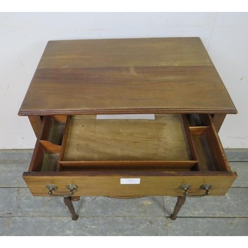 803 - An Edwardian mahogany two-tier worktable, having one long frieze drawer with reeded brass handles an... 