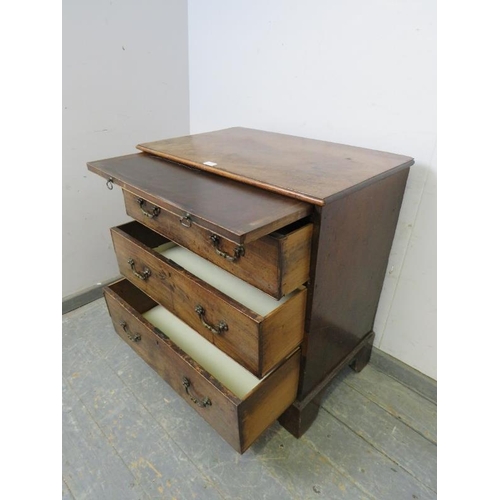 809 - An 18th century mahogany chest, having a pull-out brushing slide above three graduated cock-beaded d... 