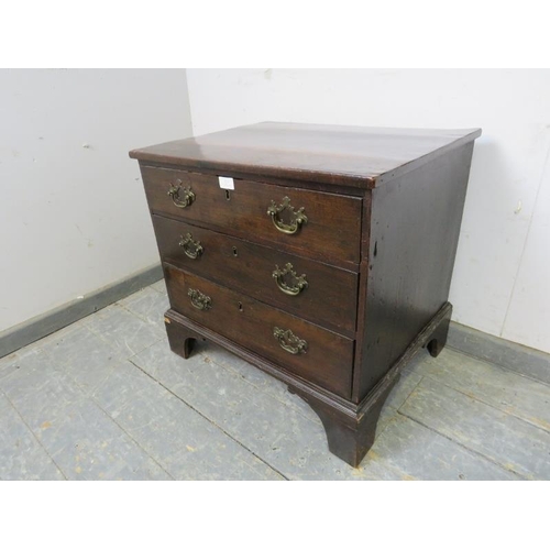 818 - A George III straight front mahogany chest of small proportions, housing three long drawers with bra... 