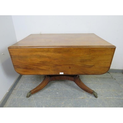 820 - A good Regency Period mahogany Pembroke table, having long drawers to either end with pressed brass ... 