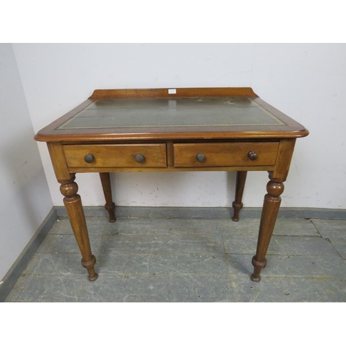 837 - A Victorian walnut writing table, the rear gallery above an inset brown leather writing surface with... 