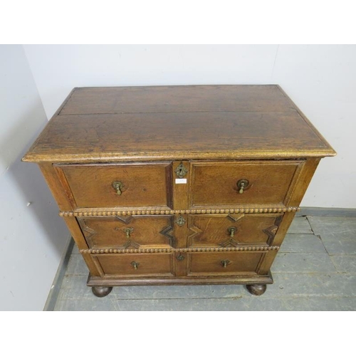 839 - A 17th century and later oak chest housing three long drawers with split moulded geometric decoratio... 