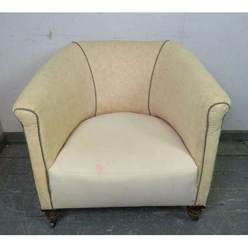 840 - A 19th century tub chair upholstered in calico with green piping, on ball feet with steel castors. 
... 