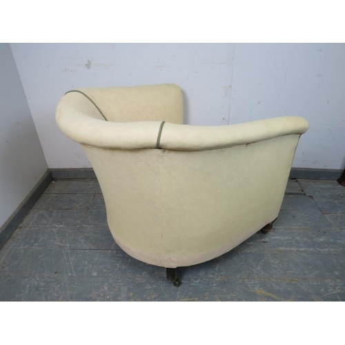 840 - A 19th century tub chair upholstered in calico with green piping, on ball feet with steel castors. 
... 