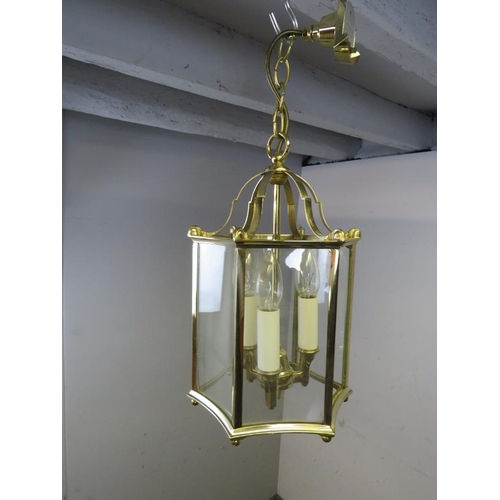 842 - An antique style six branch chandelier, together with an Edwardian style brass hall lantern. 
Chande... 