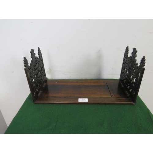 849 - A Victorian rosewood extending tabletop bookshelf, with finely carved and pierced fretwork end suppo... 